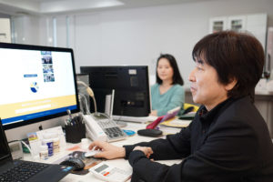 Morita and Oda working in their new office in Nishinomiya